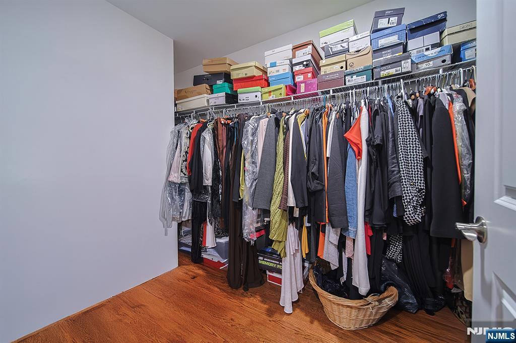 1003 Cumbermeade Road Fort Lee, NJ 07024 - Photo 20 of 38 a view of walk in closet with clothes