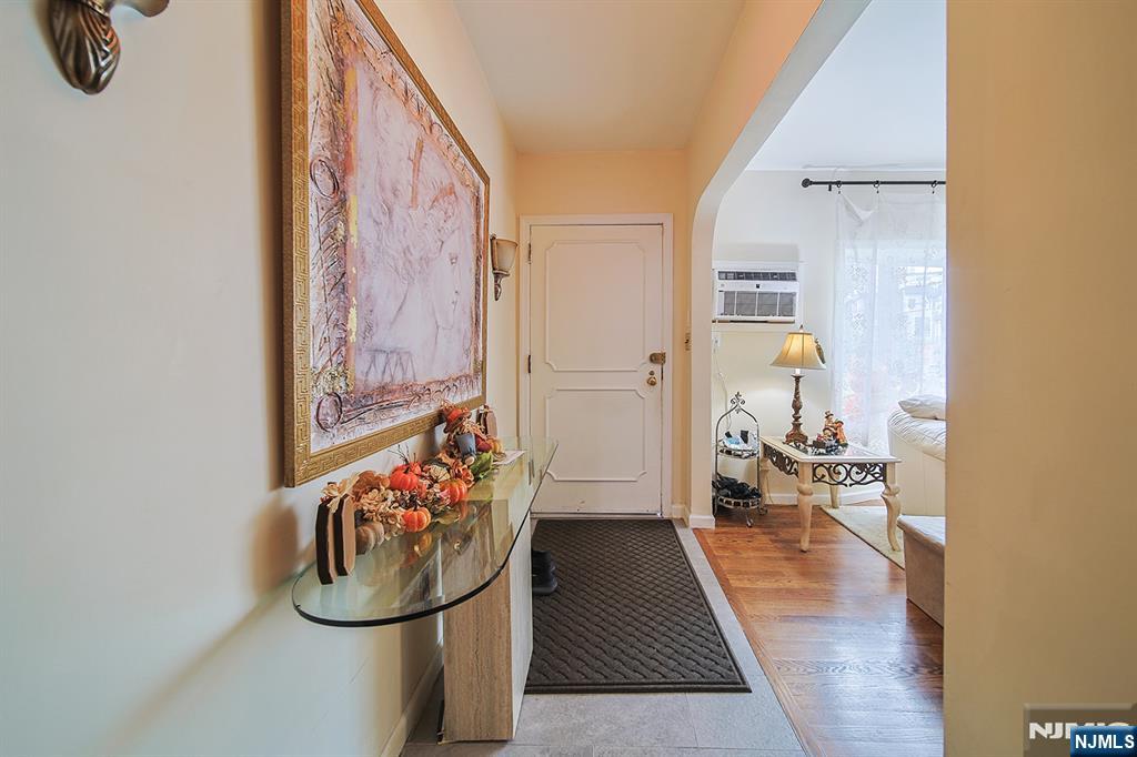 1003 Cumbermeade Road Fort Lee, NJ 07024 - Photo 25 of 38 a living room with furniture and a potted plant