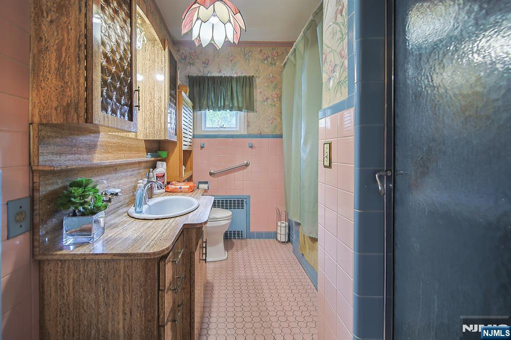 1003 Cumbermeade Road Fort Lee, NJ 07024 - Photo 26 of 38 a view of a dining room with furniture and a chandelier