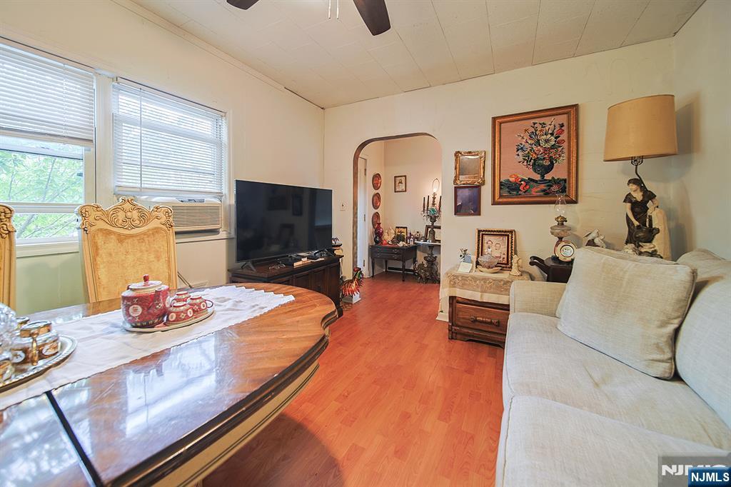 1003 Cumbermeade Road Fort Lee, NJ 07024 - Photo 32 of 38 a living room with furniture and a flat screen tv
