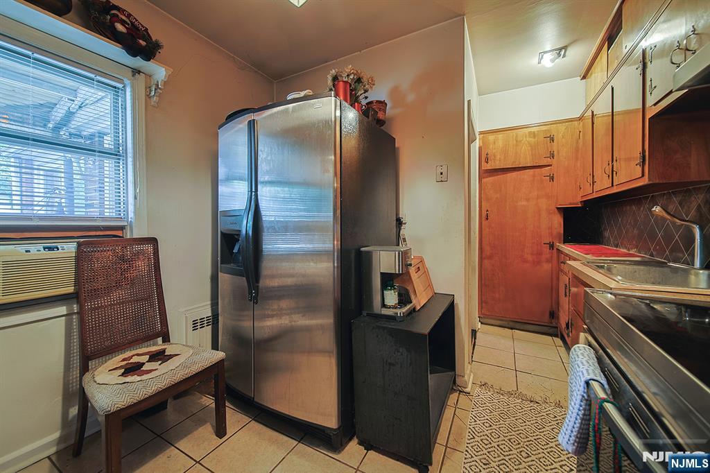1003 Cumbermeade Road Fort Lee, NJ 07024 - Photo 35 of 38 a kitchen with a refrigerator and a stove