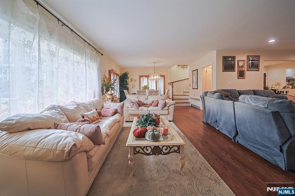 1003 Cumbermeade Road Fort Lee, NJ 07024 - Photo 5 of 38 a living room with furniture or couch and a wooden floor
