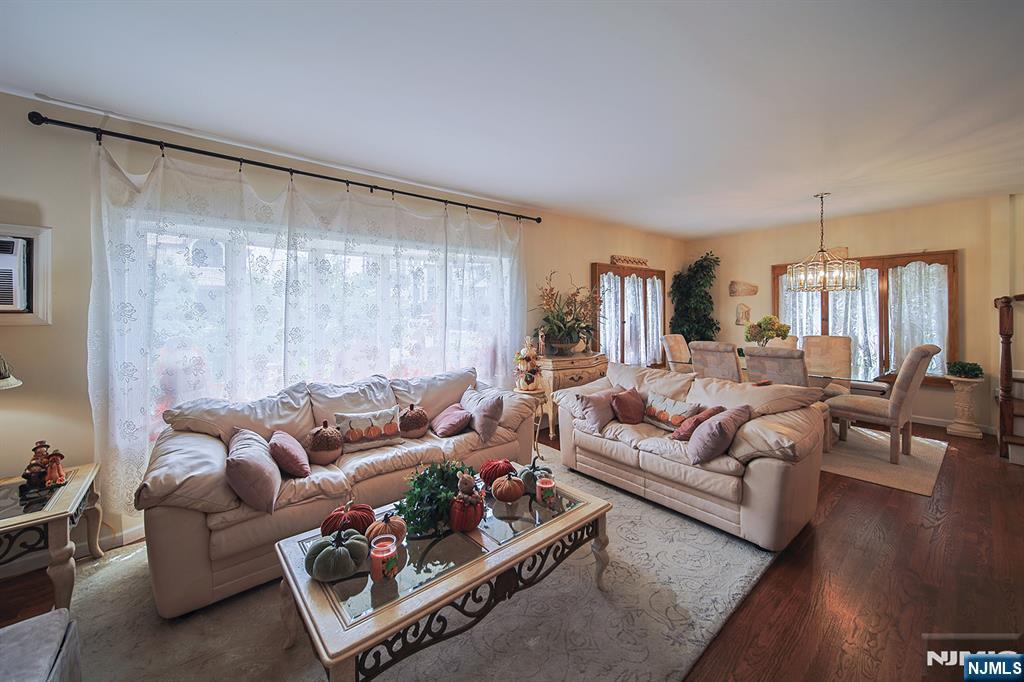 1003 Cumbermeade Road Fort Lee, NJ 07024 - Photo 8 of 38 a living room with furniture and a large window