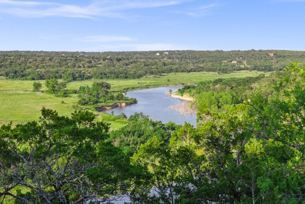 2101 Tower Road Georgetown, TX 78628 - Photo 34 of 38 a view of a lake with houses in the back