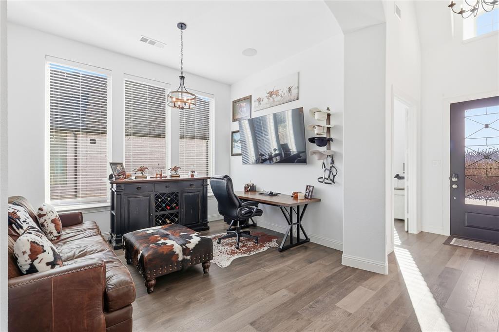 6508 Cooper Creek Road Flower Mound, TX 76226 - Photo 6 of 39 a living room with furniture a flat screen tv and a large window