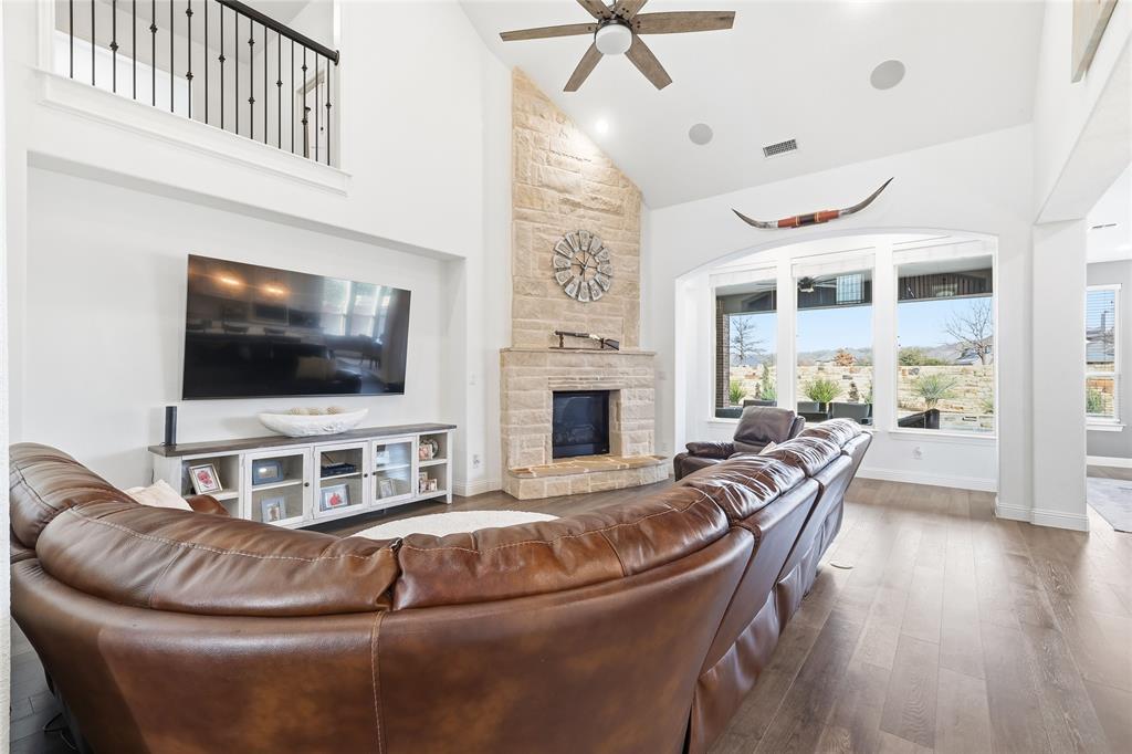 6508 Cooper Creek Road Flower Mound, TX 76226 - Photo 9 of 39 a living room with furniture and a flat screen tv