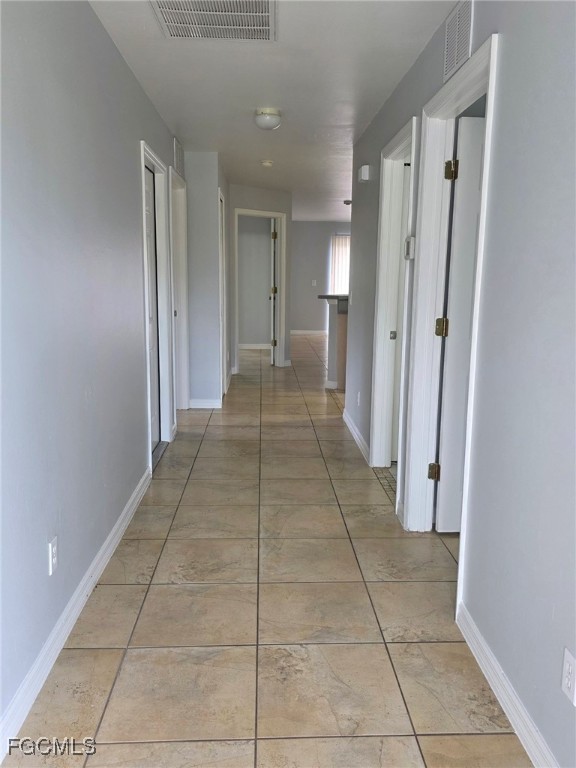 2502 Park Road Lehigh Acres, FL 33971 - Photo 2 of 17 a view of hallway with a bathtub and a shower