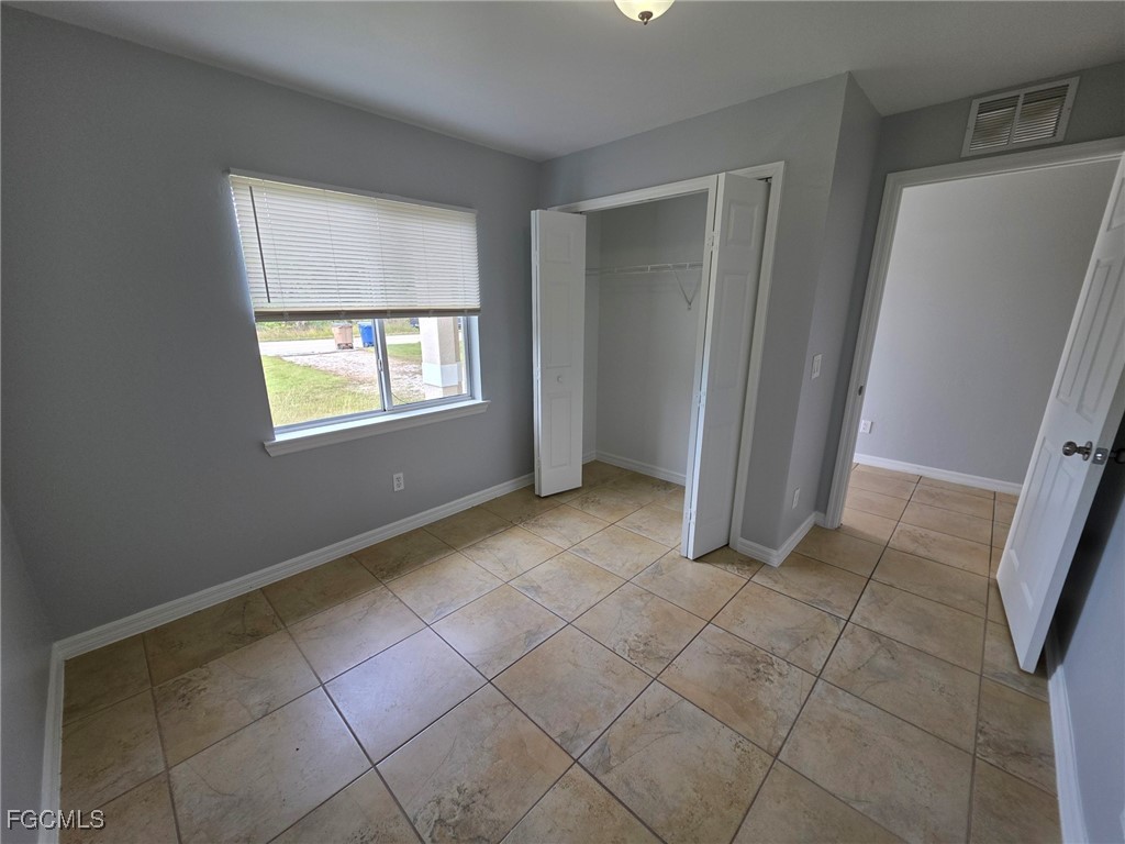 2502 Park Road Lehigh Acres, FL 33971 - Photo 4 of 17 an empty room with windows