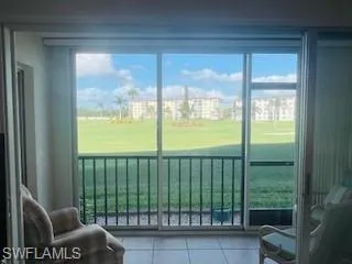 a view of a glass door and porch
