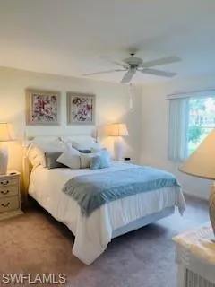 a spacious bedroom with a bed and a window