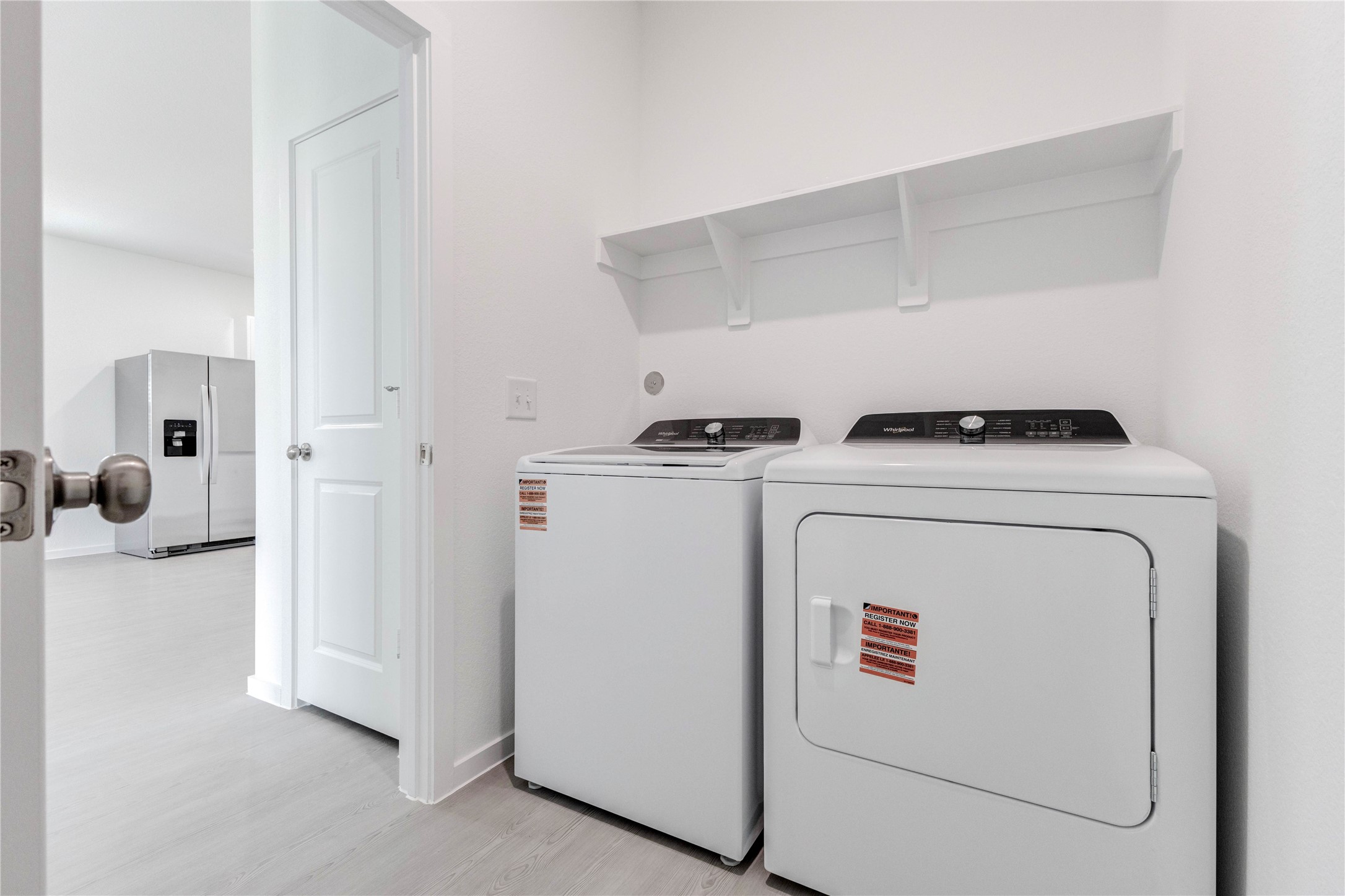 15011 Rustic Moon Road Conroe, TX 77302 - Photo 11 of 26 a utility room with dryer and washer