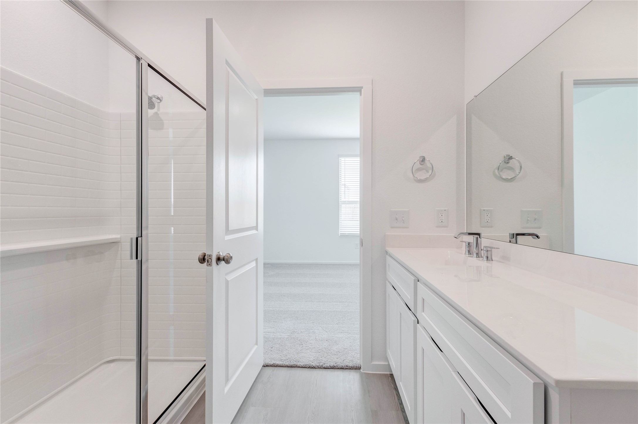 15011 Rustic Moon Road Conroe, TX 77302 - Photo 19 of 26 a bathroom with a double vanity sink and mirror