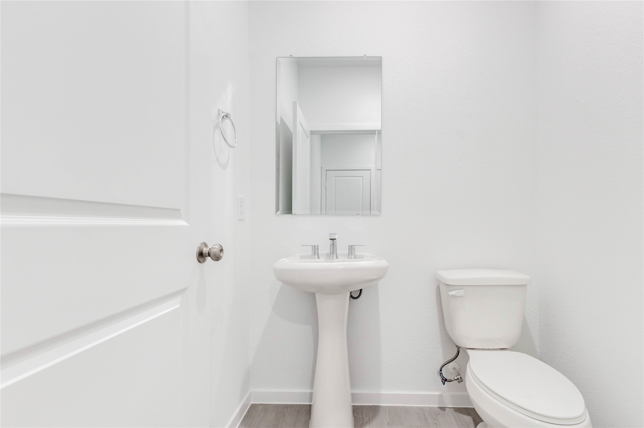 15011 Rustic Moon Road Conroe, TX 77302 - Photo 20 of 26 a bathroom with a toilet a sink and mirror