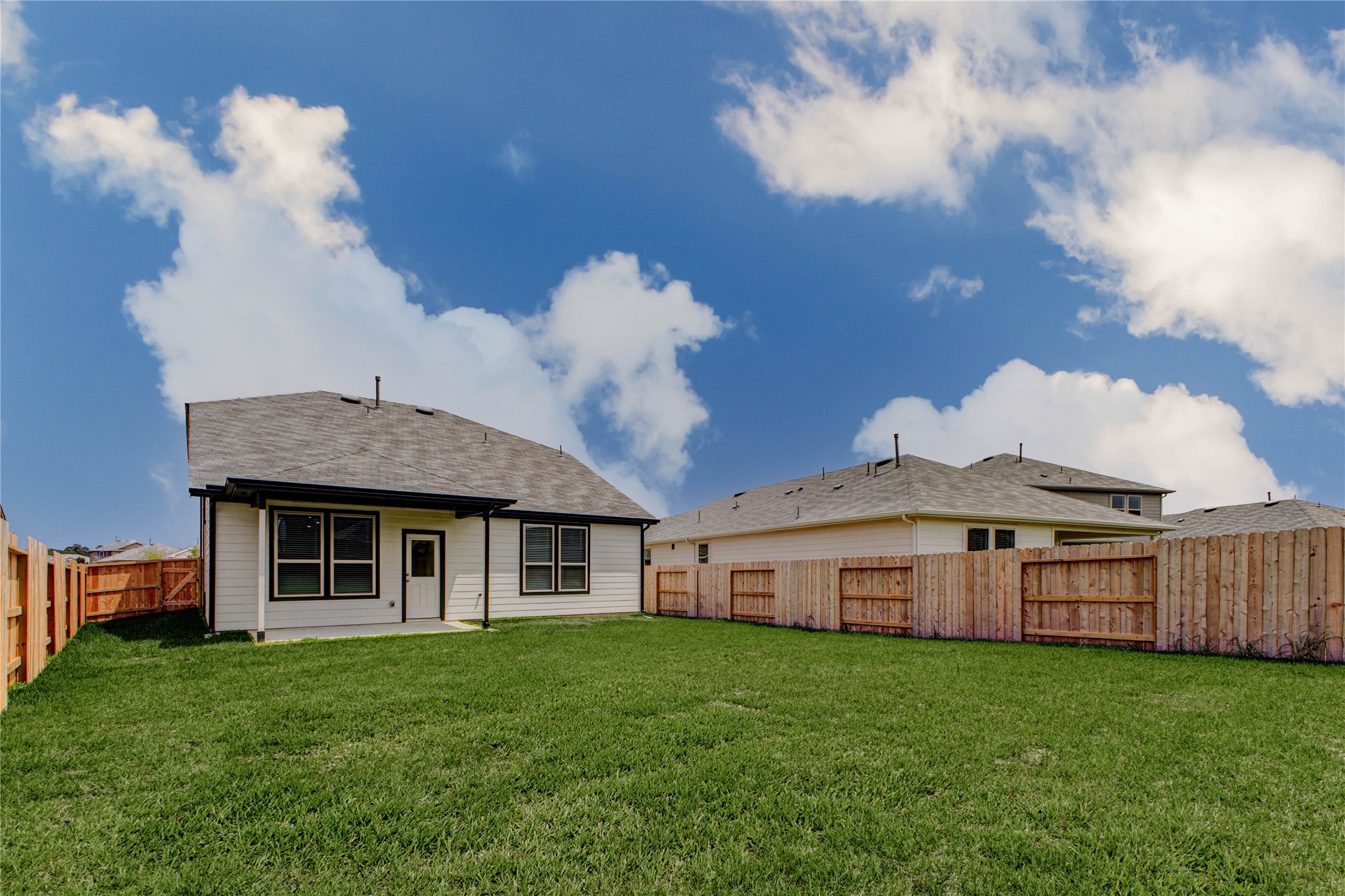 15011 Rustic Moon Road Conroe, TX 77302 - Photo 25 of 26 a view of a house with backyard