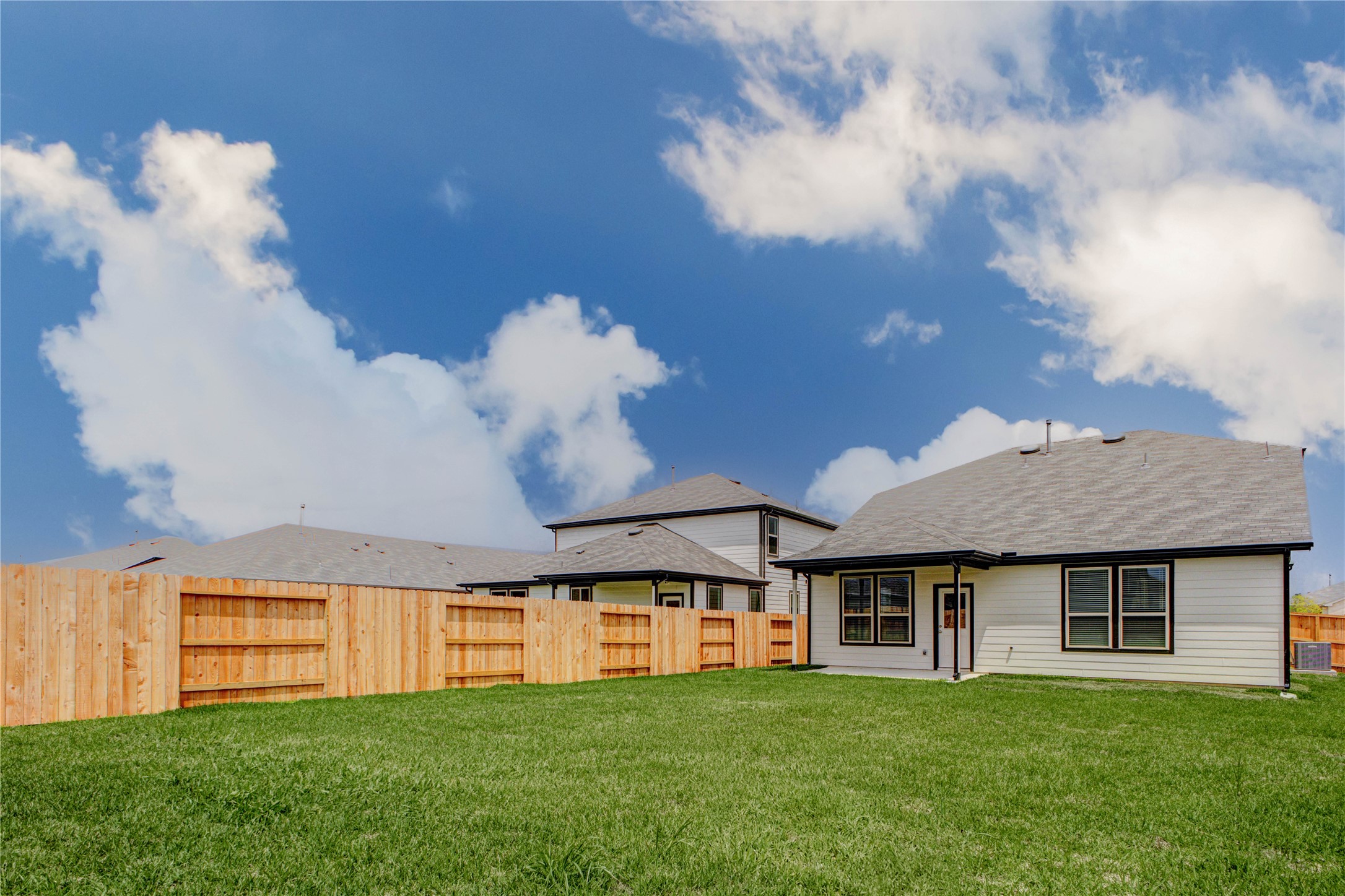 15011 Rustic Moon Road Conroe, TX 77302 - Photo 26 of 26 a view of a house with a big yard and a large tree