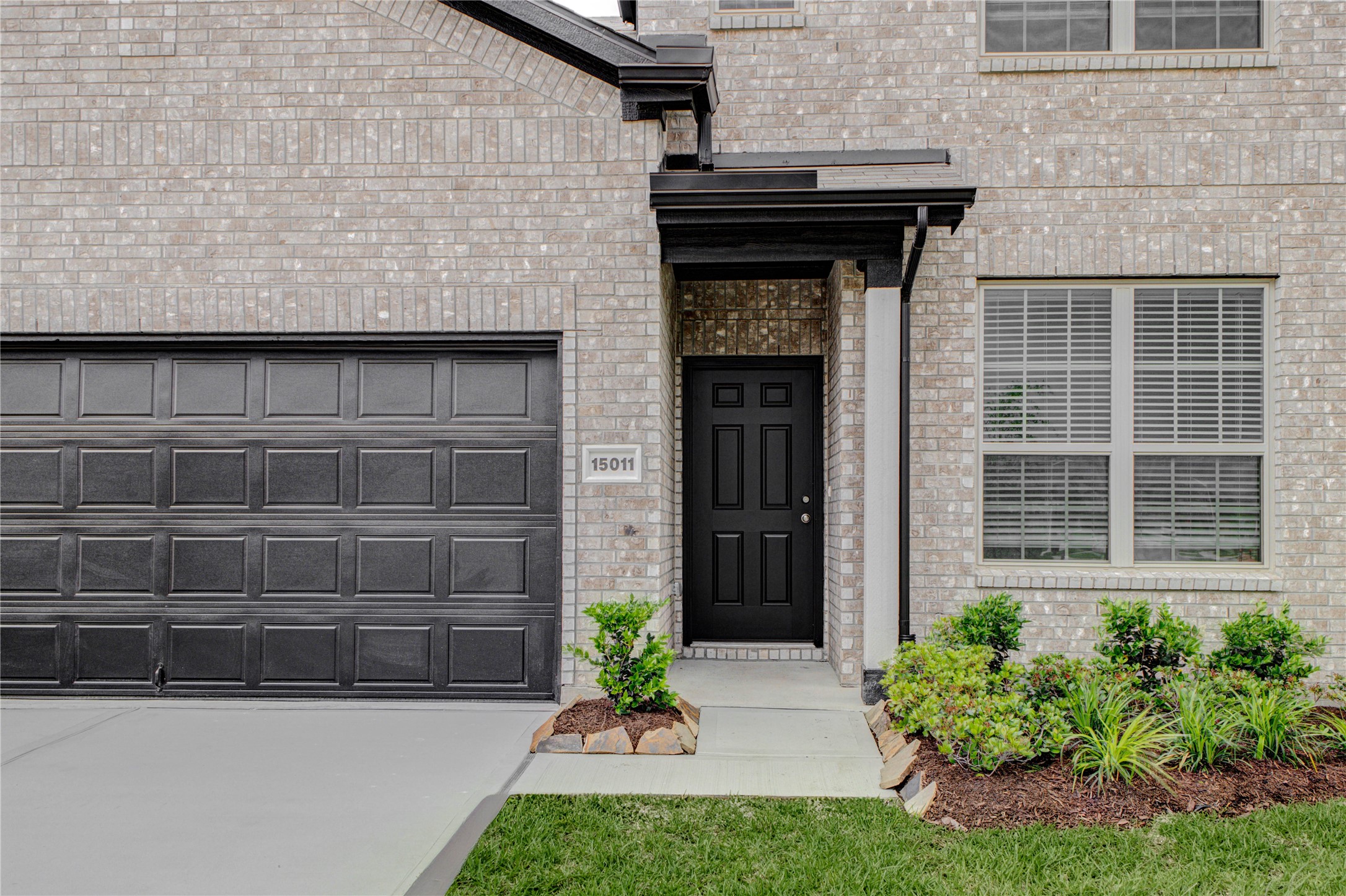 15011 Rustic Moon Road Conroe, TX 77302 - Photo 3 of 26 a front view of a house with a yard
