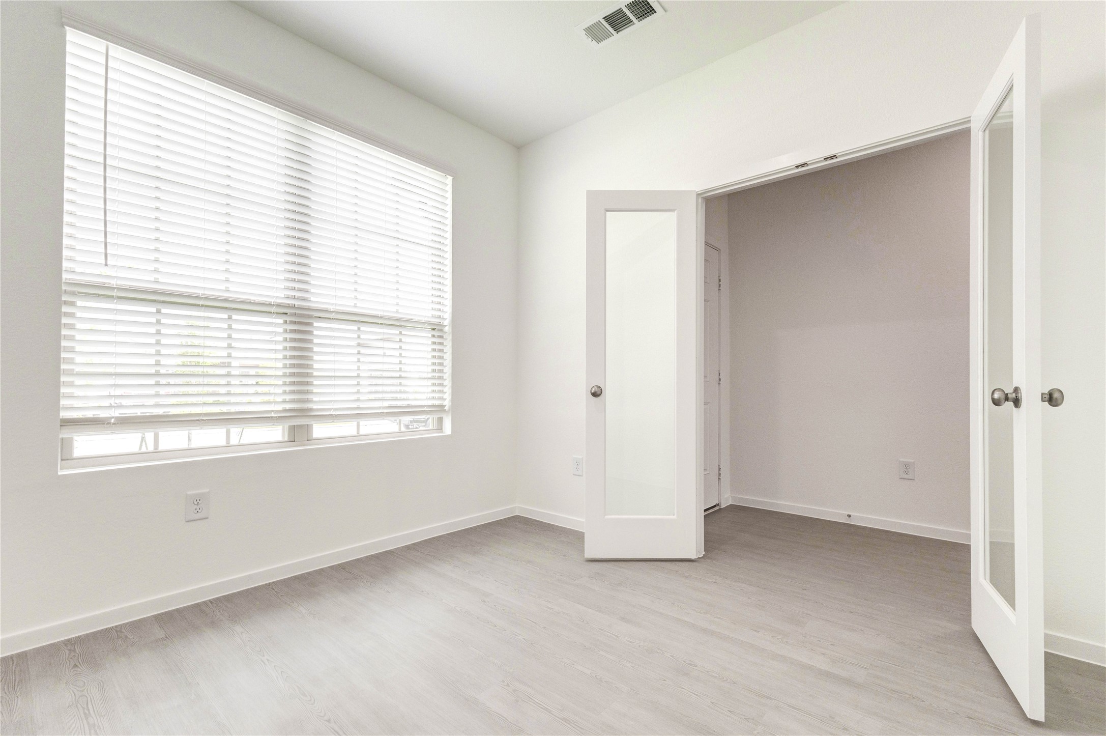 15011 Rustic Moon Road Conroe, TX 77302 - Photo 4 of 26 a view of an empty room with a window