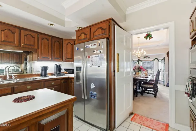 a hallway with beautiful frames and flower vase