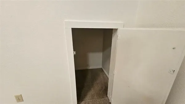 a view of a bathroom with a glass shower door