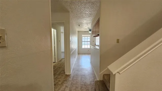 a view of a bathroom from a corridor