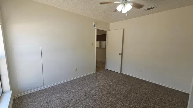 an empty room with a empty space and windows