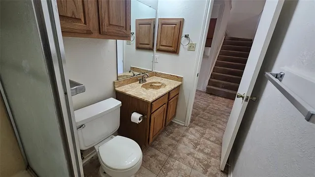 an empty room with a window and a ceiling fan