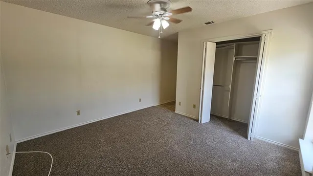 a white toilet sitting next to a sink