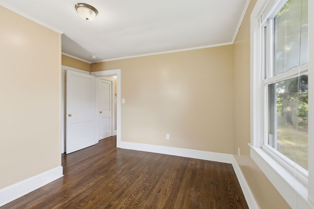 7604 Highway 252 Honea Path, SC 29654 - Photo 24 of 33 This airy room features rich hardwood flooring and sunlit windows, creating a versatile living space.