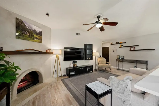 a living room with furniture and a fireplace