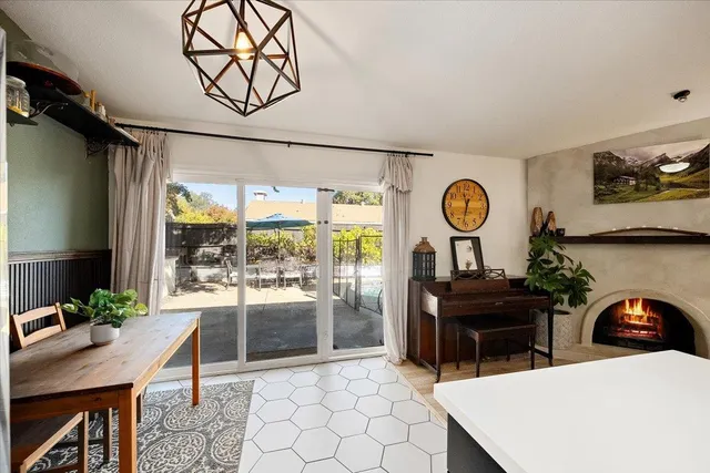 a view of hallway with wooden floor and furniture