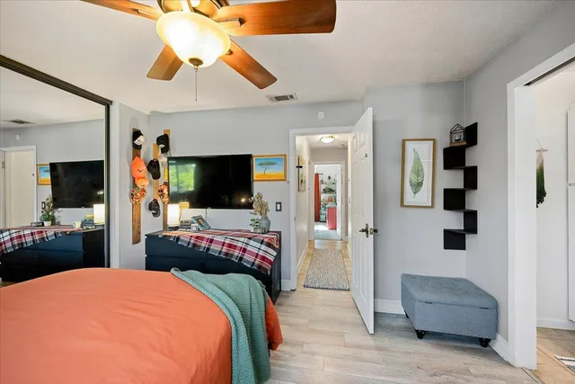 a bedroom with bed and furniture