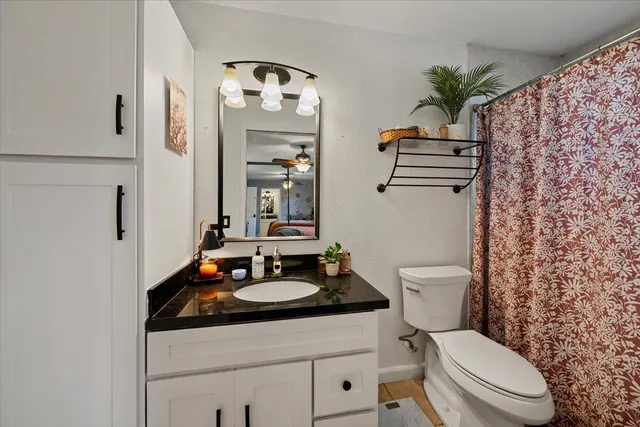 a bedroom with furniture and a window