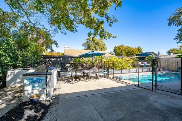 a view of a chairs and table in the patio