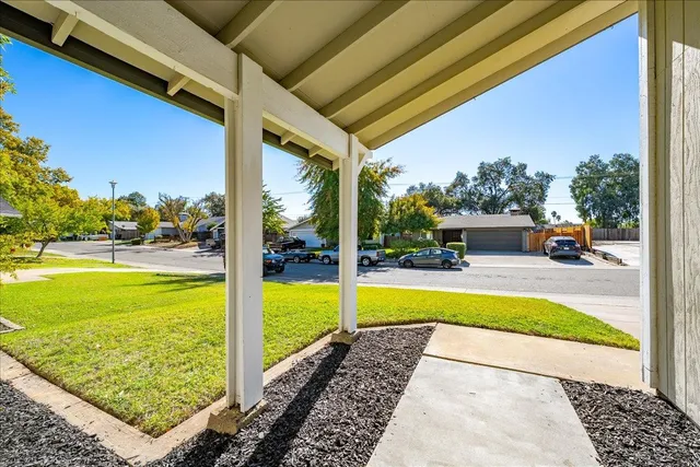 a view of swimming pool with lawn chairs and couches