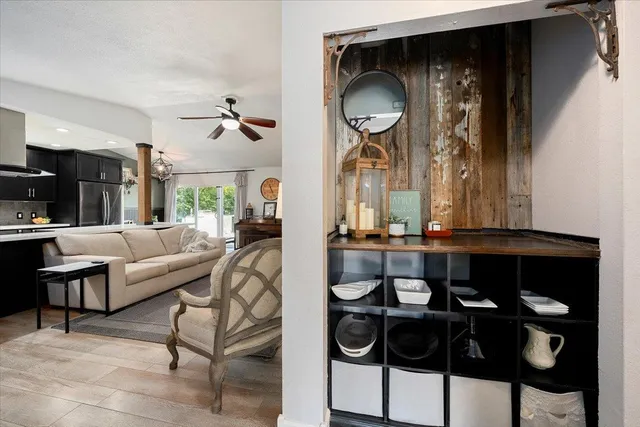 a living room with furniture and a window