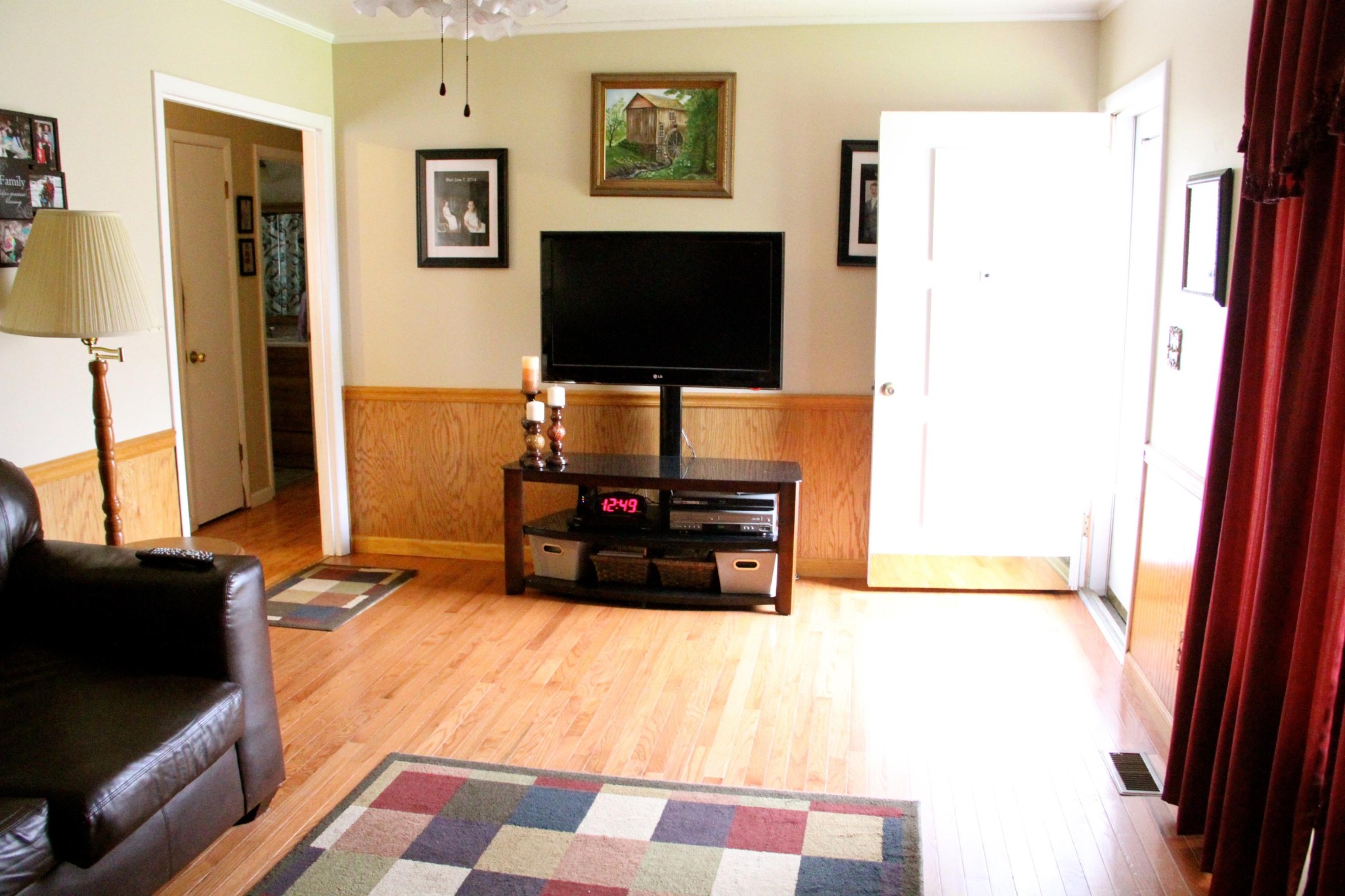 1111 Carding Machine Road Loudon, TN 37774 - Photo 4 of 21 a living room with a flat screen tv and a refrigerator