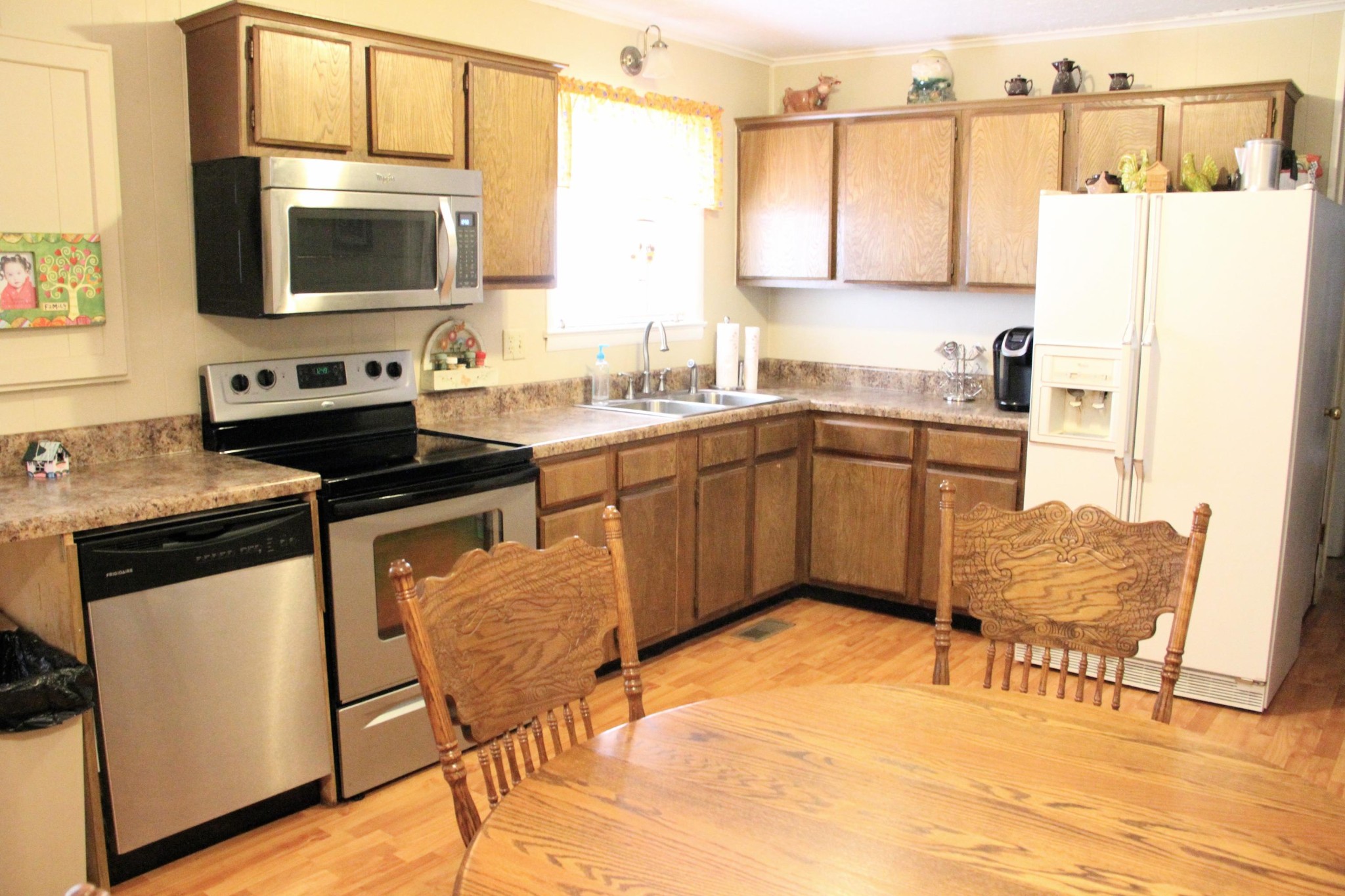 1111 Carding Machine Road Loudon, TN 37774 - Photo 8 of 21 a kitchen with stainless steel appliances kitchen island granite countertop a sink and cabinets