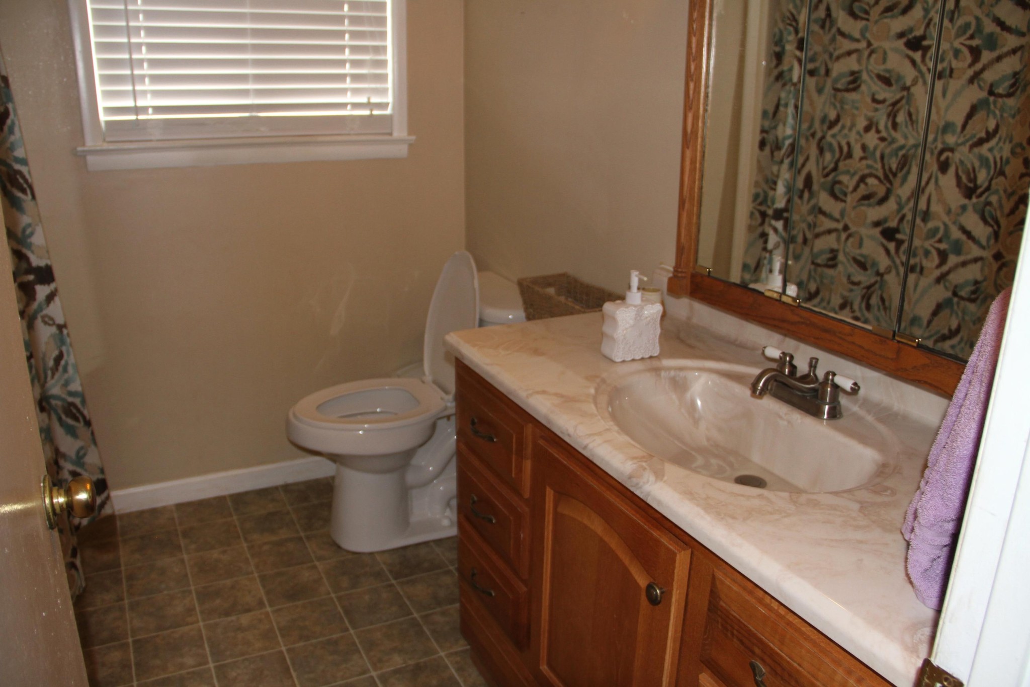 1111 Carding Machine Road Loudon, TN 37774 - Photo 9 of 21 a bathroom with a granite countertop sink toilet and a mirror