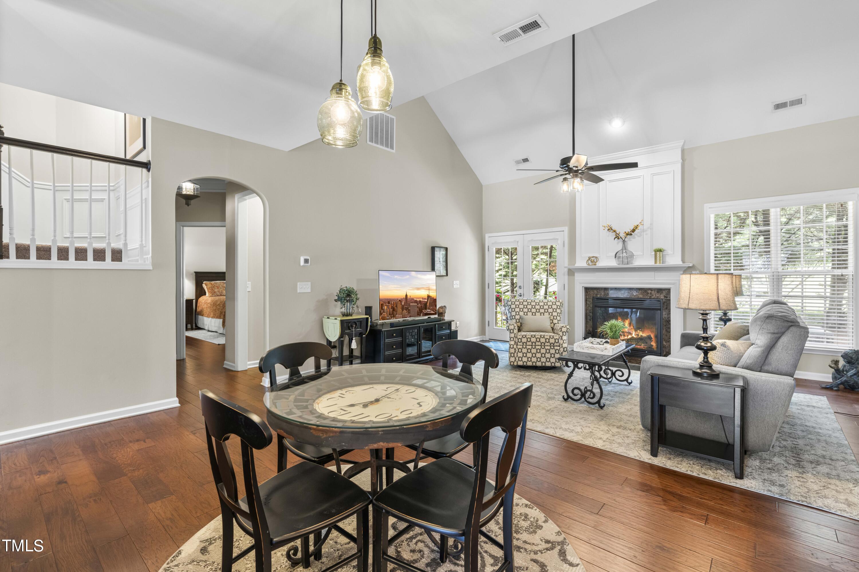 4604 Manassa Pope Lane Raleigh, NC 27612 - Photo 12 of 43 a view of a dining room with furniture wooden floor and chandelier