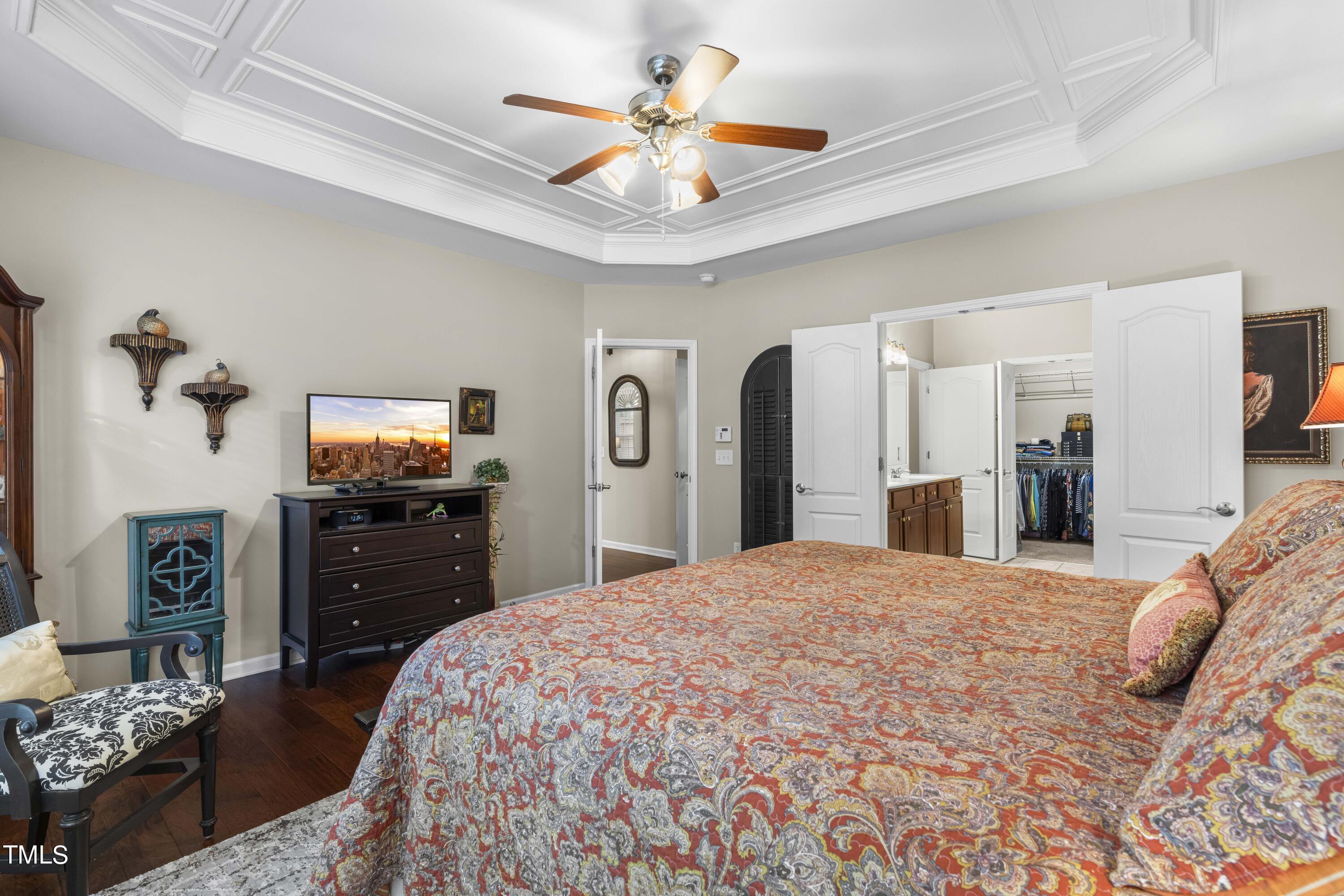 4604 Manassa Pope Lane Raleigh, NC 27612 - Photo 18 of 43 a bedroom with a bed and dresser
