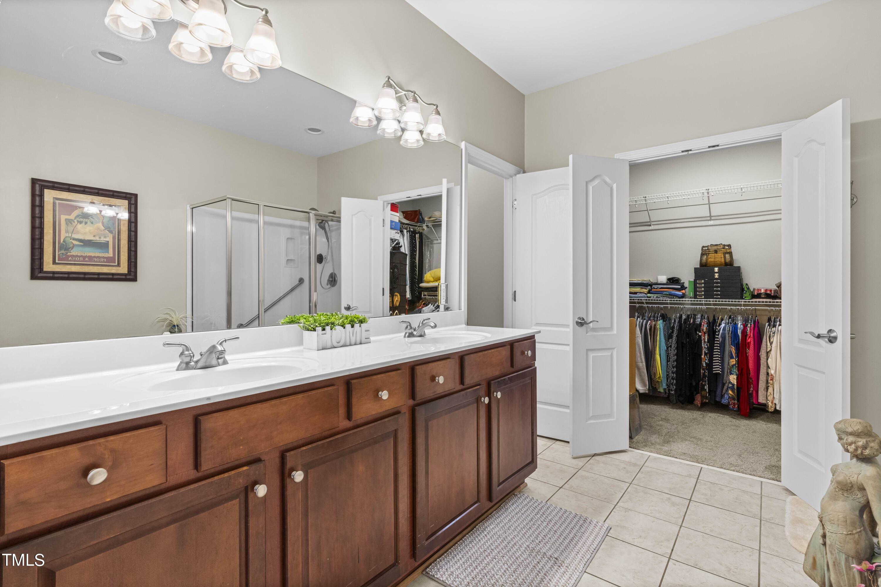 4604 Manassa Pope Lane Raleigh, NC 27612 - Photo 20 of 43 a spacious bathroom with a sink double vanity and a mirror