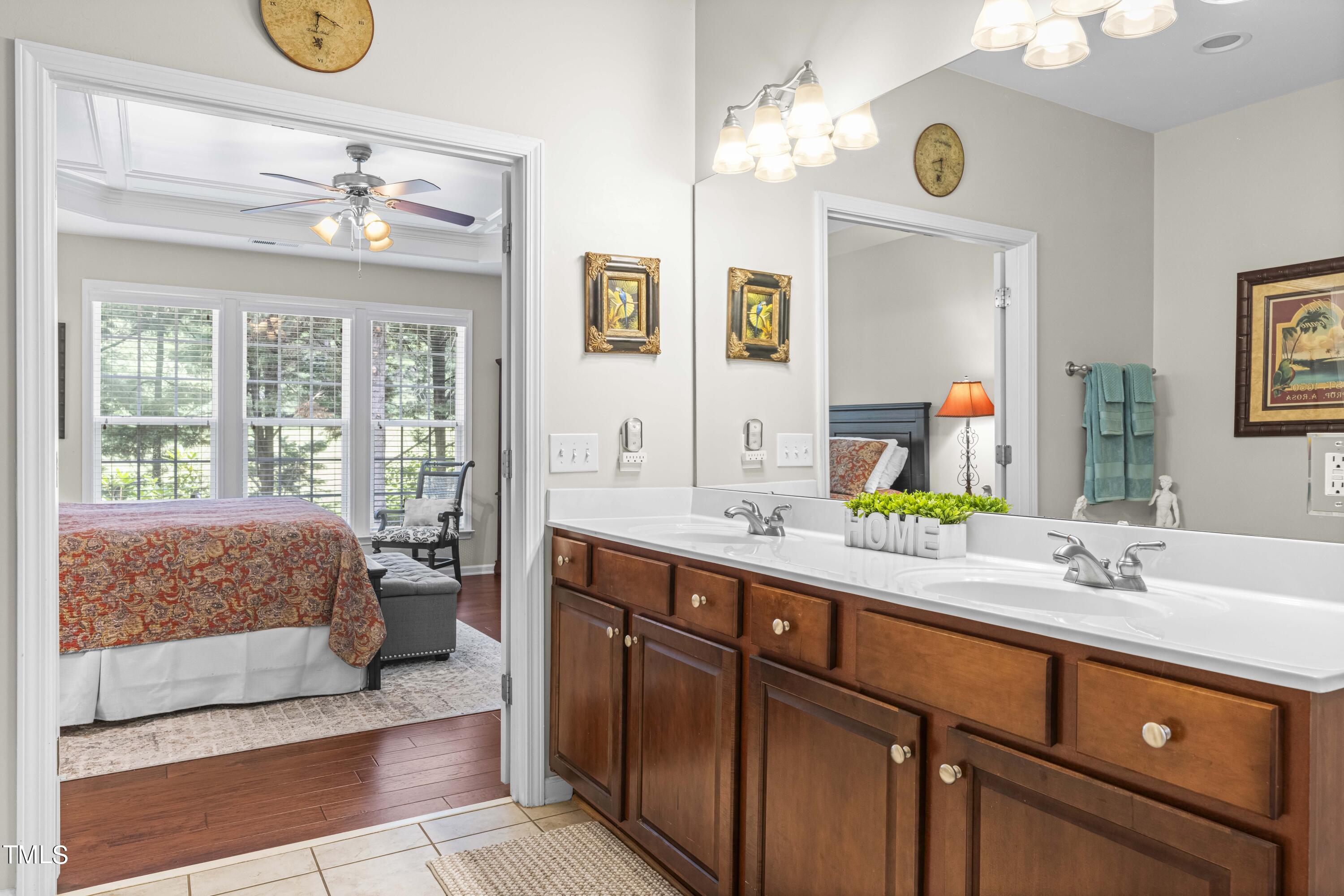 4604 Manassa Pope Lane Raleigh, NC 27612 - Photo 22 of 43 a bathroom with a sink a vanity and a mirror