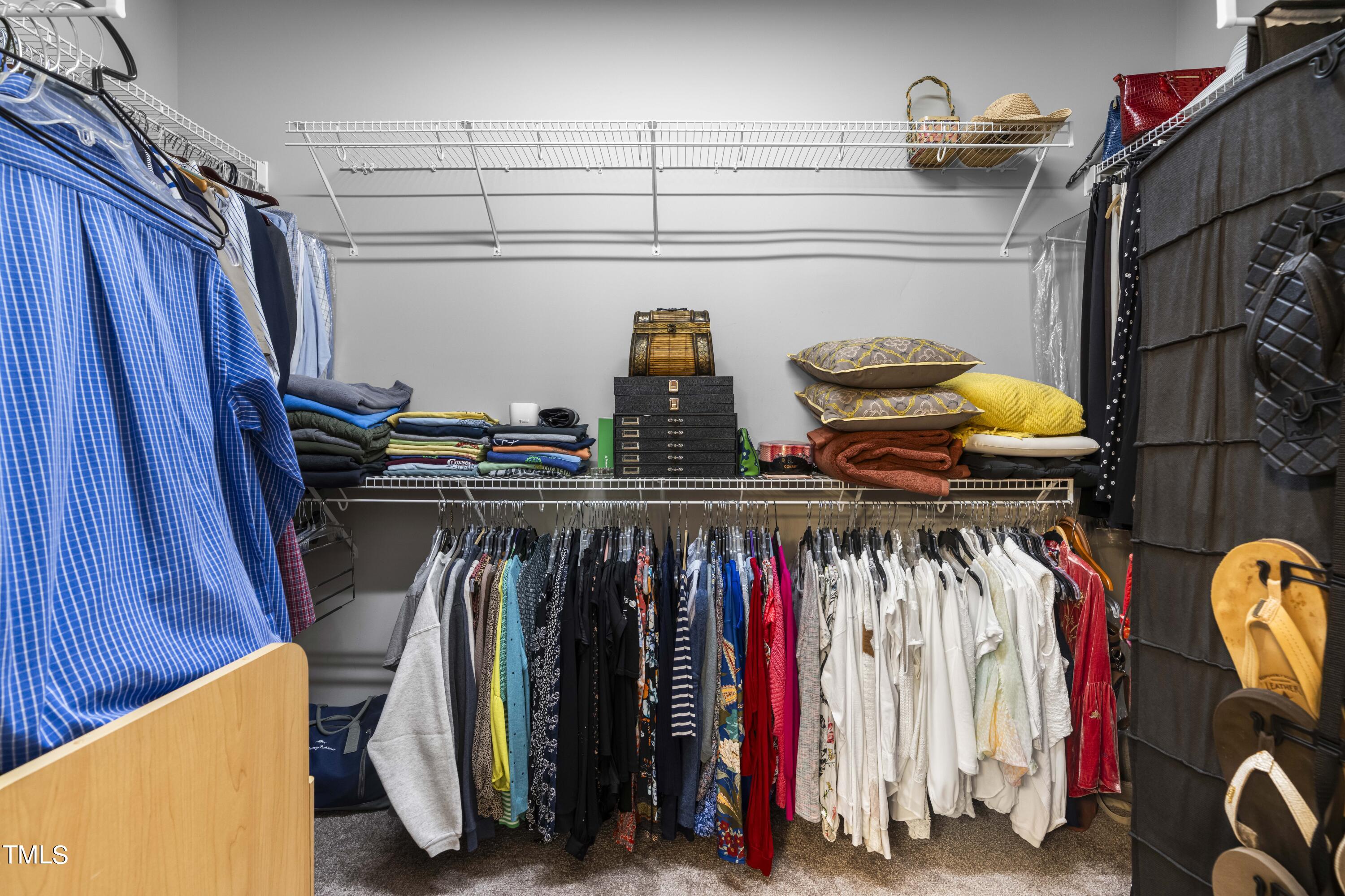 4604 Manassa Pope Lane Raleigh, NC 27612 - Photo 23 of 43 a view of walk in closet with clothes and shoes