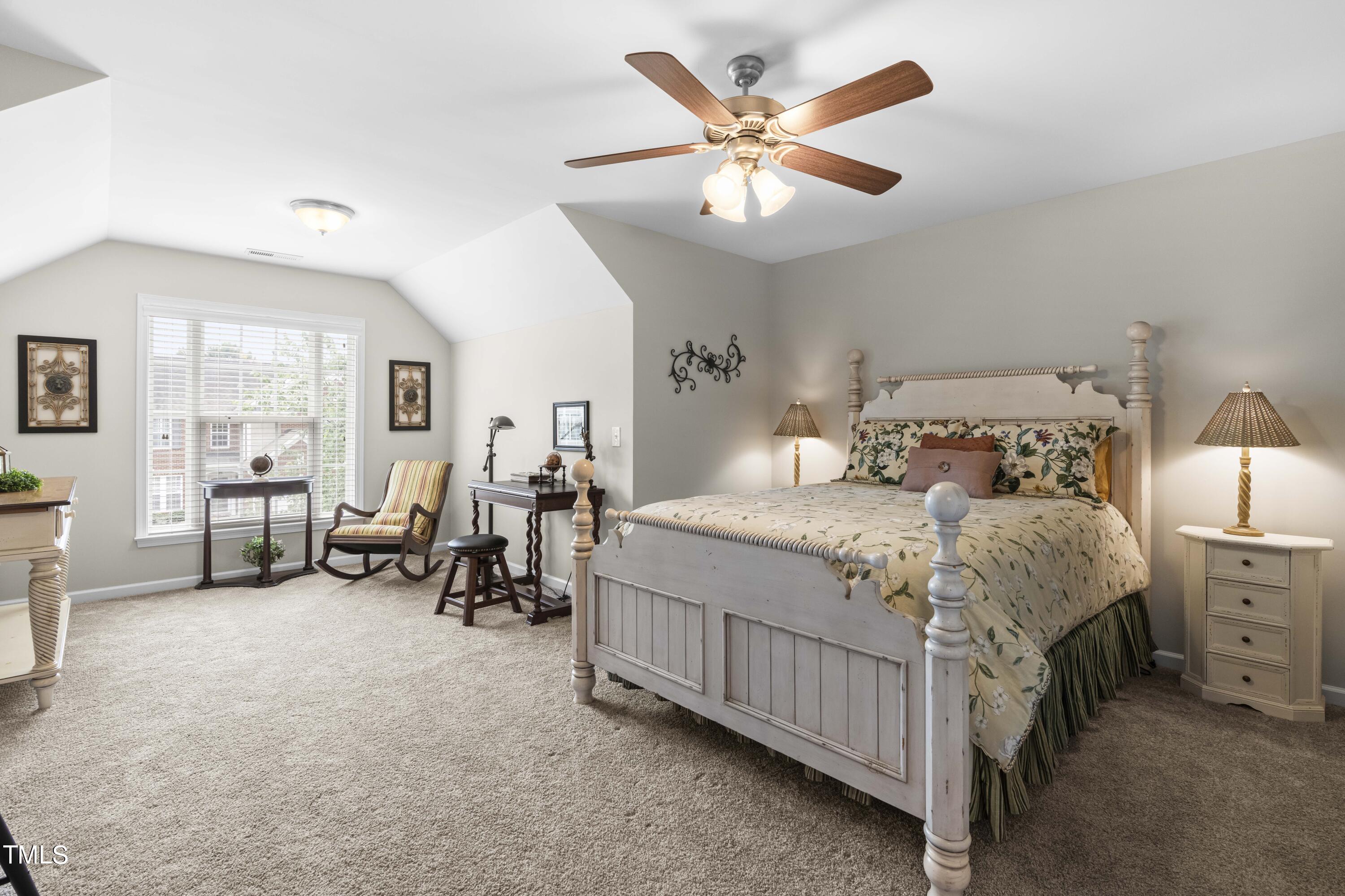 4604 Manassa Pope Lane Raleigh, NC 27612 - Photo 26 of 43 a bedroom with bed and a large window