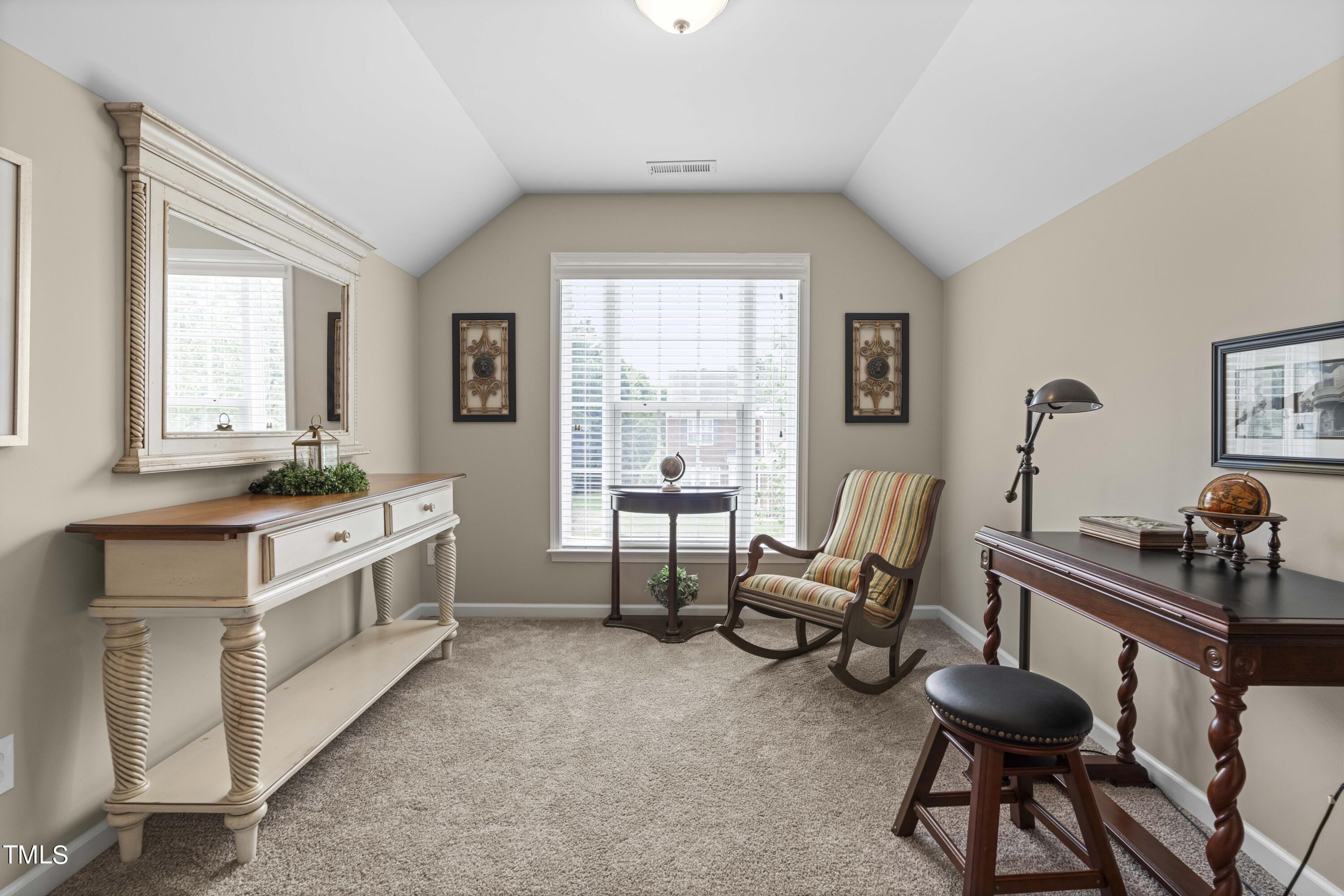 4604 Manassa Pope Lane Raleigh, NC 27612 - Photo 28 of 43 a living room with furniture and a large window