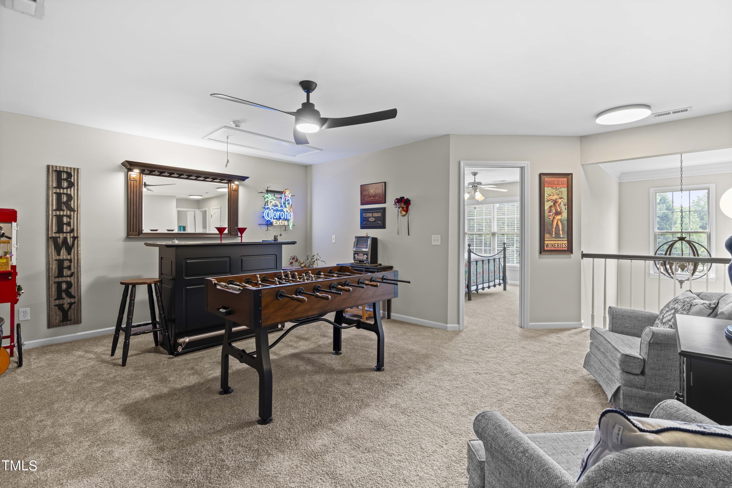 4604 Manassa Pope Lane Raleigh, NC 27612 - Photo 33 of 43 a living room with furniture a piano and a flat screen tv