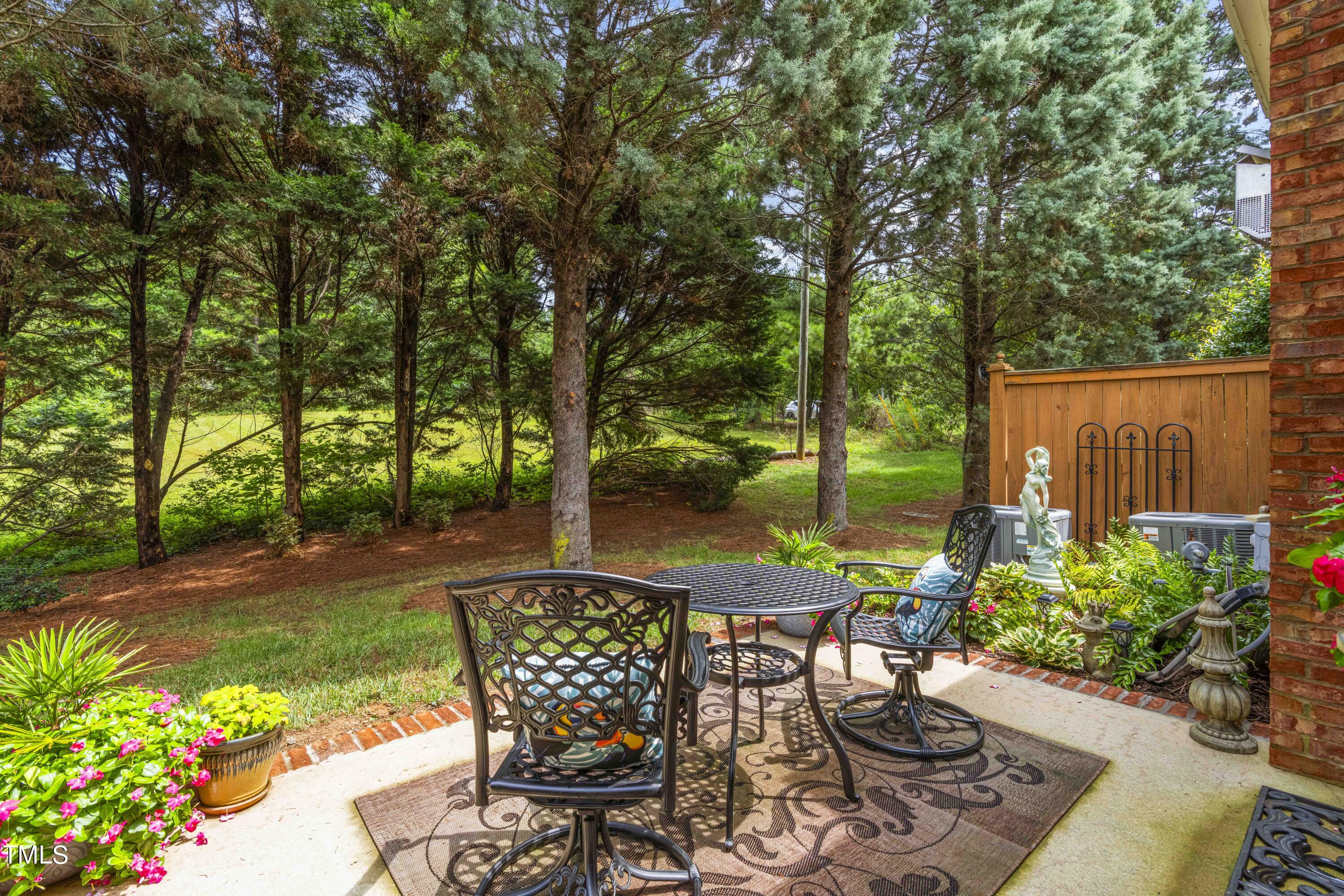 4604 Manassa Pope Lane Raleigh, NC 27612 - Photo 37 of 43 a view of a chairs and table in backyard
