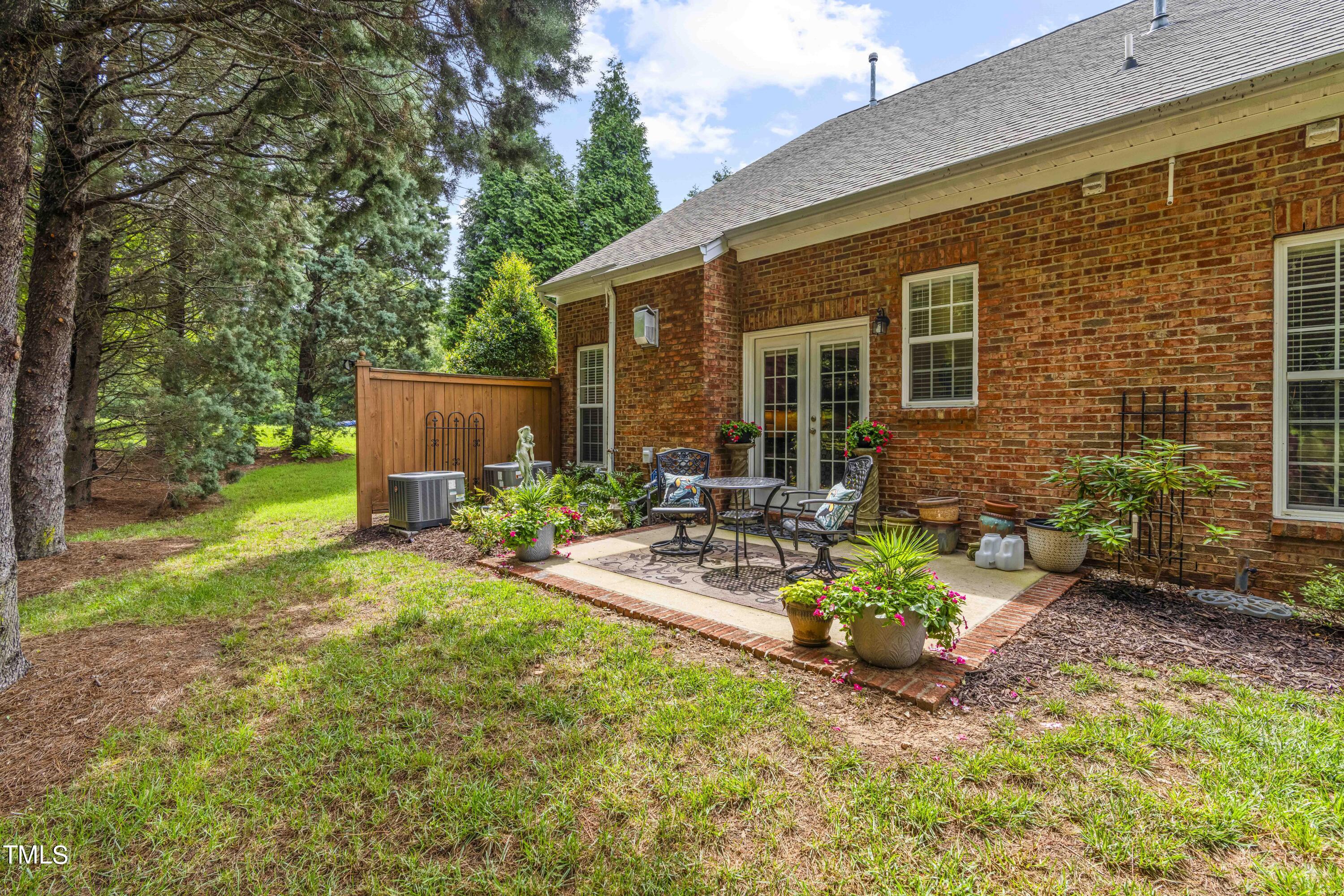4604 Manassa Pope Lane Raleigh, NC 27612 - Photo 38 of 43 a view of a backyard with sitting area and garden
