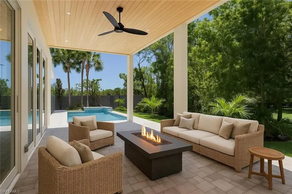 a outdoor living space with patio furniture and garden view