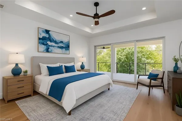 a bed room with a bed and a large window